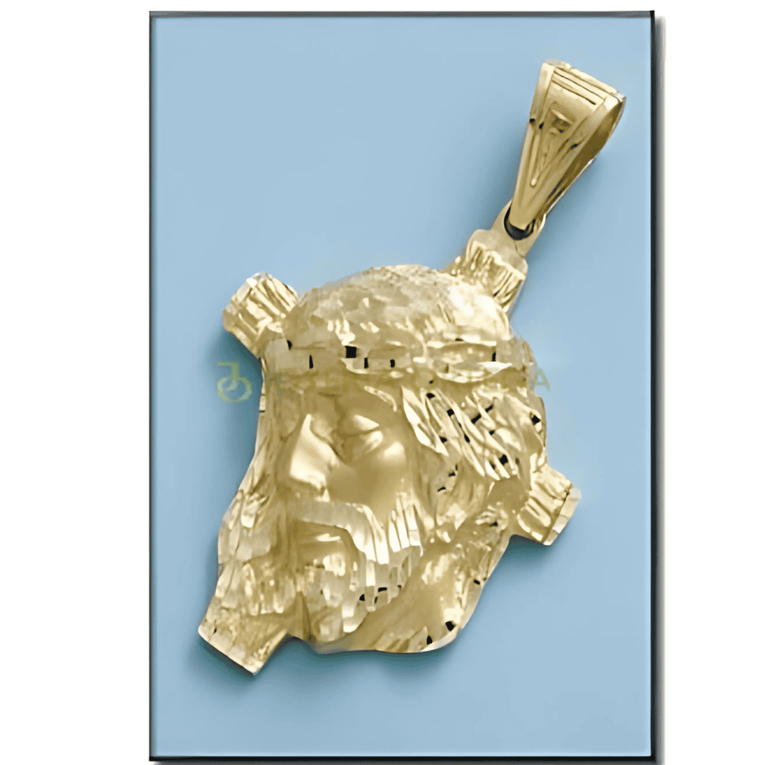 Colgante de oro con rostro esculpido